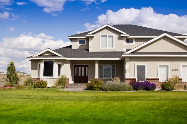 suburban house Beautiful modern design house home with blue sky and green grass